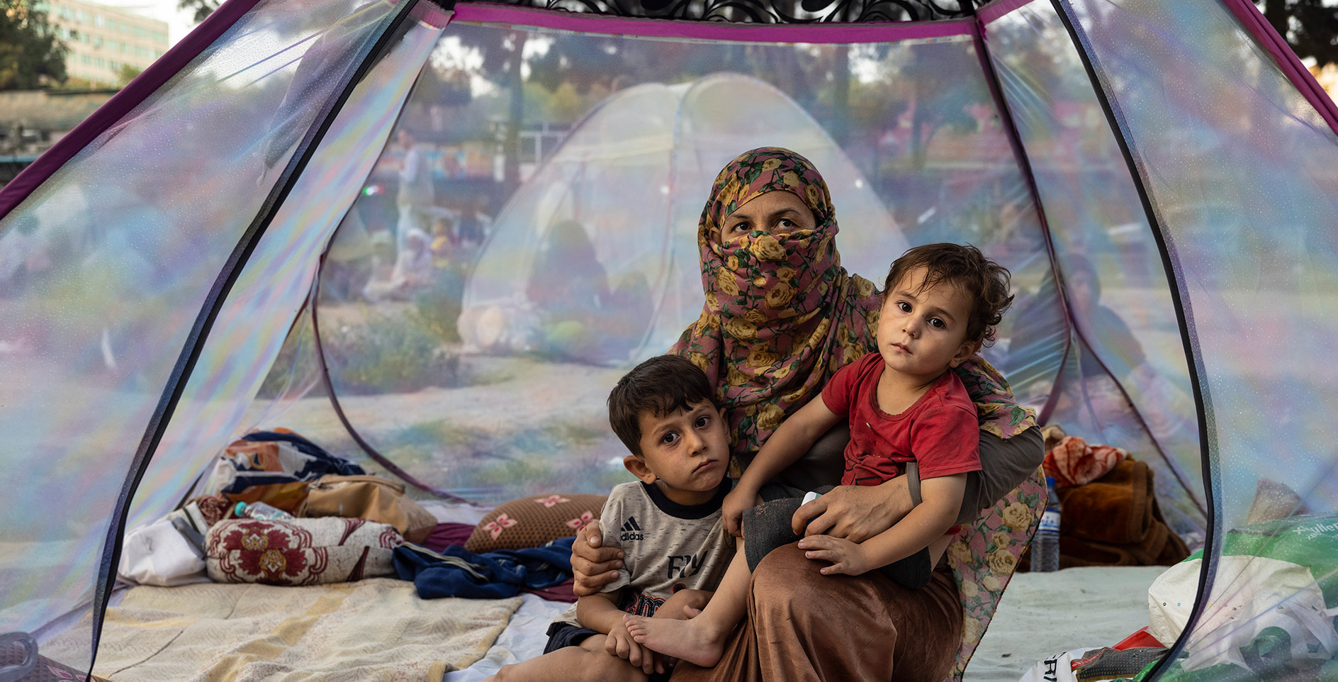 Afghan widow and children displaced by the Taliban